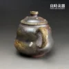 張家誌手作入炭柴燒壺耳形圓把與金黃落灰結晶背面視覺