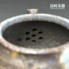 張家誌手作入炭柴燒壺內壁七孔梅花狀濾網工藝細節特寫