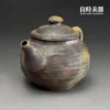 台灣茶器推薦-張家誌手作柴燒窯變弦紋仿鼓壺直流壺嘴與出水細節